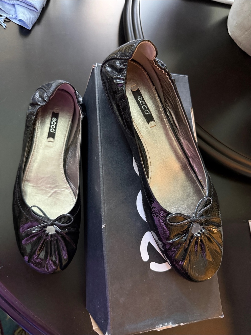 Black patin slip-on shoes